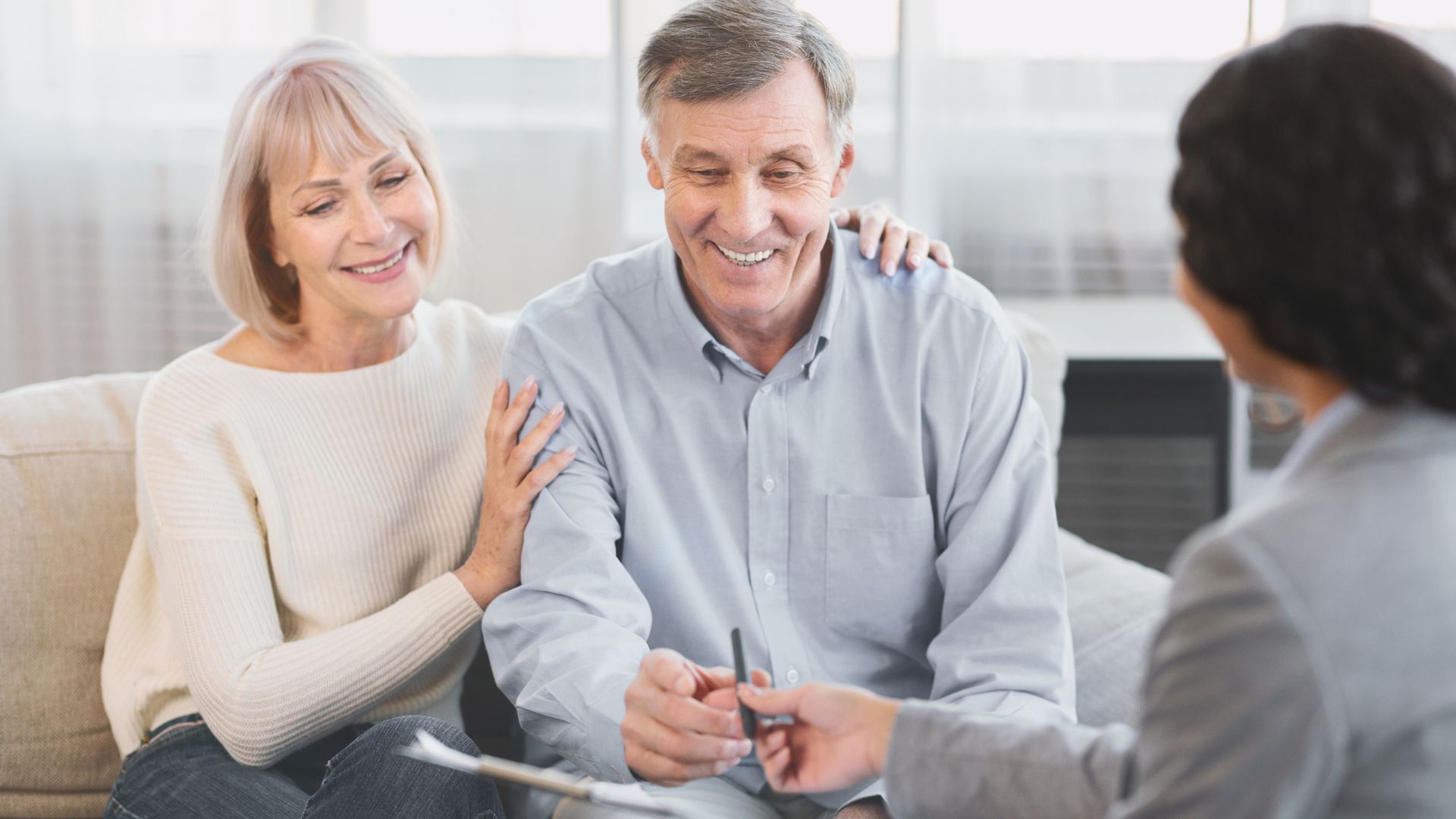 Preferred Insurance Colorado - Medicare - Medicare Advantage vs Medigap - older couple meeting with independent medicare broker smiling
